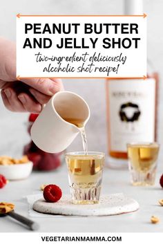 a person pouring tea into a glass with raspberries around it and the words, peanut butter and jelly shot