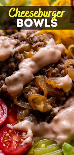 cheeseburger bowls with tomatoes, peppers and onions on a white plate topped with dressing