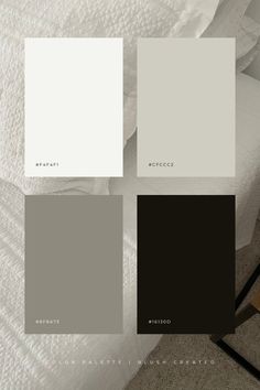 some white and grey paint colors on a bed