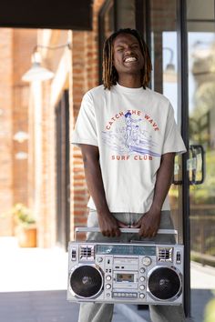 Embrace the surf lifestyle with our 'Catch the Wave Surf Club' tee, perfect for beach lovers and surf enthusiasts alike. Care instructions: Machine wash: warm (max 40C or 105F); Non-chlorine: bleach as needed; Tumble dry: medium; Do not iron; Do not dry-clean. Processing Times: We will process your order within 3 days and have it sent to our courier! How long does delivery take? We offer free worldwide delivery on all of our products, but please give us some leeway as we have multiple warehouses Casual Short Sleeve T-shirt For Water Sports, Crew Neck Tops For Water Sports In Summer, Casual Tops For Water Sports In Summer, Casual Summer Tops For Water Sports, Sporty Crew Neck T-shirt For Surfing, Casual Short Sleeve Tops For Water Sports, Summer Water Sports Short Sleeve T-shirt, Short Sleeve Graphic Print Tops For Water Sports, Sporty Graphic Print Beach Tops