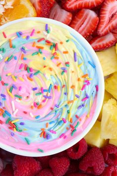 a white bowl filled with fruit and sprinkles