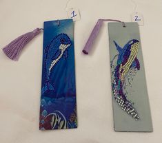 two bookmarks decorated with beads and tassels