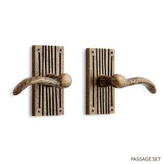 two decorative door handles on a white background