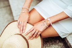 a woman's hands on the back of her hat