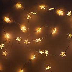 a string of star shaped lights on a wall