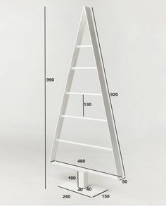 a tall white shelf with three shelves on each side, and measurements for the top