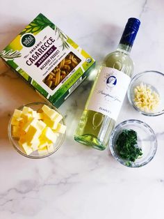 ingredients to make an appetizer laid out on a marble counter top