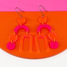 Bright and bold in hot pink, neon pink and orange to bring that ZING to your outfit! These are 2 1/2 inches long on handcrafted titanium earwires Pink And Orange Earrings, Neon Pink Jewelry, Hot Pink Dangle Earrings, Hot Pink Clay Earrings, Bright Pink Earrings, Retro Adjustable Pink Earrings, Vibrant Pink Handmade Earrings, Vibrant Handmade Pink Earrings, Handmade Vibrant Pink Earrings