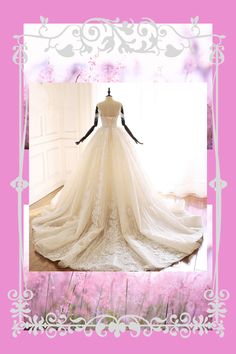 a wedding dress on display in a pink frame