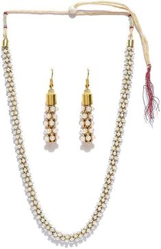 Enhance your traditional attire with the South Indian Style Pearl Beads Necklace Set for Women. Featuring a beautifully crafted necklace and matching earrings adorned with lustrous pearl beads, this set is perfect for weddings, festivals, and special occasions. Crafted with high-quality materials for a luxurious finish, it combines elegance and comfort. Jewelry Sets With Round Beads For Celebrations, Pearl Jewelry Sets For Festivals, Festive Pearl Jewelry Set With Pearl Chain, Festival Pearl Jewelry Sets With Pearl Chain, Festive Pearl Drop Jewelry Sets, Bollywood Style Pearl Kundan Necklace, Festive Bollywood Jewelry Sets With Pearl Chain, Pearl Drop Necklace For Diwali Party, Pearl Jewelry Sets For Diwali