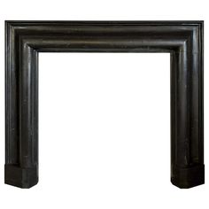 an old fashioned black fireplace surround