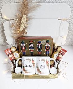 a christmas gift basket with coffee mugs and nutcrackers