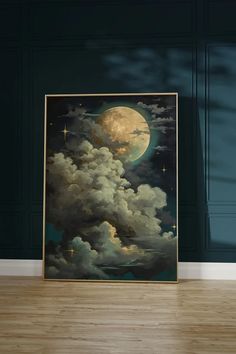 a painting on the floor in front of a wall with clouds and a full moon