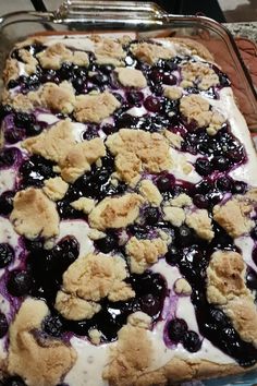 a blueberry cobble is sitting on a baking sheet