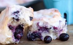 blueberry scones cut in half on a cutting board