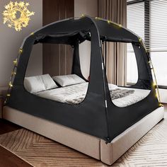 a tent bed with lights on it in the middle of a room next to a window