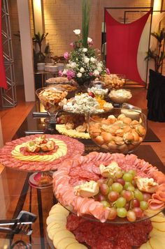 a buffet table filled with lots of different types of foods and desserts on it