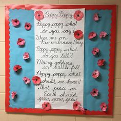 a bulletin board with paper flowers and writing on it that reads happy birthday, dear