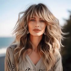 35 Flattering Hairstyles for Women Over 50 with Bangs Layered Beach Hair, Beach Wave Hair With Bangs, Bangs With Long Hair Blonde, Side Bangs With Long Hair Layers, Long Hair Older Women Over 50 Style, Long Hair For Women Over 50, Beach Waves With Bangs, Face Framing Layers Long Hair With Bangs, Bangs For Older Women With Long Hair