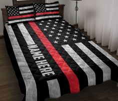 a bed with an american flag quilt on it