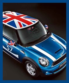 a mini cooper with the british flag painted on it's hood is shown in this image