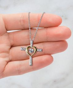 - Cross Dancing Necklace: Weight: 0.14 oz Stunning .925 Sterling Silver necklace.  AAAA grade cubic zirconia jewels set throughout the cross. Featuring a "dancing stone" centerpiece that is a large AAAA grade cubic zirconia stone. The gold heart is triple plated in 14K gold. The pendant is 1 inch (25mm) in length and 0.85 inch (21.6mm) in width.  The wishbone necklace chain length is shorter, a total of 17.5 inches including the extender, and the other necklaces chain length is 19.5 inches. Our Christmas Dancing, Dancing Pendant, Card Jewelry, Wishbone Necklace, Message Necklace, Wife Necklace, Cross Heart, Dance Necklace, Bonus Mom