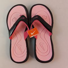 They Are New With Tag Nike Flip Flops Pink And Black Color. The Size On Them Says 5y But I Am Women's Size 8 And They Fit Me Perfectly. The Problem Is, I Don't Like Flip Flops. They Are A Tiny Bit Over 10 Inches Long, Measured On Top Through The Middle Of The Footpad. They Are 4 Inches At The Widest Part. They Are A Pink Soft Fabric On The Inside. Pink Cushioned Slip-on Flip Flops, Black Nike Synthetic Flip Flops, Pink Casual Slip-on Flip Flops, Pink Slip-on Flip Flops, Pink Synthetic Flip Flops, Pink Non-slip Casual Flip Flops, Pink Synthetic Round Toe Flip Flops, Pink Non-slip Comfortable Flip Flops, Comfortable Non-slip Pink Flip Flops