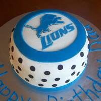 a detroit lions birthday cake with blue and white frosting