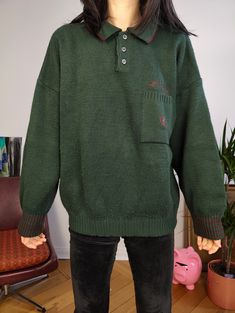 DESCRIPTION Vintage dark green polo collar knitted sweater made from 50% wool fabric. This thick pullover has a logo embroidery on the chest.  CONDITION This vintage knit is in great vintage condition with very light piling SIZING This vintage knit is estimated as size M and is labelled as size L > please check measurements below as all vintage sizes are different Measurements: Arms till shoulder seam: 47cm Shoulder till shoulder seam: 70cm Armpit to armpit: 62cm Back: 63cm Model is size XS/S and is 1m65 MATERIAL 50% wool 50% acryl Made in Italy WITH LOVE  All vintage items are washed/treated from Berlin with a lot of love As they are all one of a kind, they might have some small imperfections. The clear flaws will be described under condition. Your favourite online vintage clothing shop Green Long Sleeve Polo Sweater With Ribbed Cuffs, Green Long Sleeve Polo Sweater For Winter, Winter Wool Sweater With Polo Collar, Winter Polo Collar Sweater With Ribbed Cuffs, Green Winter Polo Sweater With Ribbed Cuffs, Winter Green Polo Sweater With Ribbed Cuffs, Green Wool Sweater With Ribbed Collar, Winter Polo Sweater With Ribbed Cuffs, Winter Polo Sweater With Ribbed Cuffs And Polo Collar