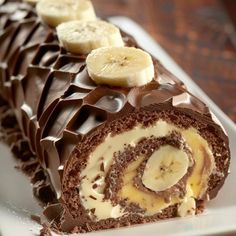 there is a chocolate roll with bananas on it