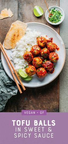 a plate filled with meatballs and rice next to chopsticks on a wooden table