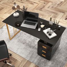 an office desk with a laptop and other items on it