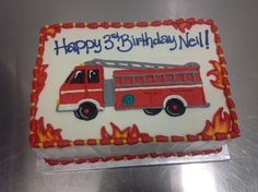 a birthday cake with a fire truck on it