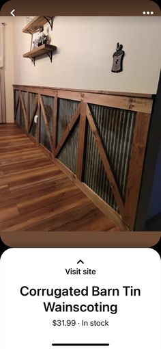 an image of a barn door being installed in a room with wood flooring and white walls