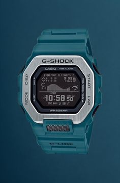 This classic G-Shock men's watch from Casio showcases a digital display in a 51mm teal stainless steel case with black dial and a quartz movement. Resistant to shock, other features include a stop watch, alarm, multiple time zones, date and backlight. The teal resin strap secures with a buckle, and the watch is water-resistant to 200 meters. Functional Green Watch With 10atm Water Resistance, Green Digital Watch For Outdoor, G Shock Men, Stop Watch, Jared The Galleria Of Jewelry, Creative Background, Time Zones, Casio G Shock, Digital Display