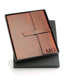 a wooden box with the initials m g on it