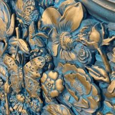 a close up view of some blue and gold flowers