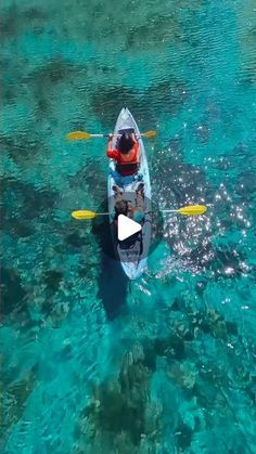 a man in a kayak on clear blue water