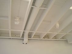 the ceiling in an office building is white