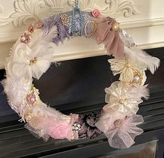 a wreath made out of fabric and feathers