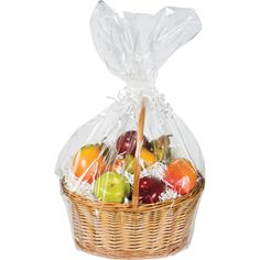 a basket filled with lots of different types of fruit in plastic wrappers on top of a white background