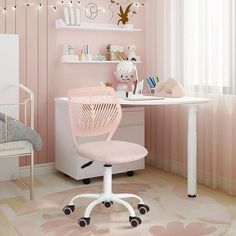 a child's bedroom with pink walls and white furniture, including a desk chair