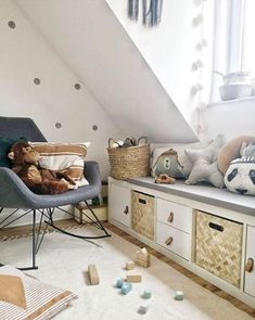 a child's room with white walls and polka dots on the wall