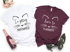 "Bachelorette Shirts are perfect for a night out or even in a bridesmaid proposal gift box. These Meowied and Purrrty shirts are a trendy pick for bachelorette party shirts! The unisex shirts will add to any wedding party. Bachelorette Party Shirt, Brides Babes Shirt, Bridal Party Shirt, Bride Shirt, Bridesmaid Gift, Bridesmaid Shirt, Wedding Party Shirt, Bachelorette Shirts HOW TO ORDER 1. Select the shirt \"Shirt Style & Size\", 2. Select the \"Text Option\", 3. Enter the shirt color and text Cat Bachelorette, Cat Squad, Getting Meowied, Babe Shirt, Wedding Party Shirts, Brides Babes, Bride Shirt, Bridesmaid Shirts, Bridal Party Shirts