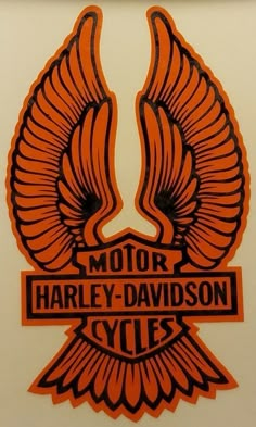 an orange and black harley davidson motorcycle emblem