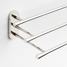 an image of a chrome towel rack on the wall with three bars attached to it