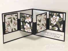 an open card with flowers on it