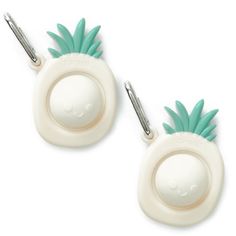 two white and green pineapple shaped ear clips with metal clippings on them