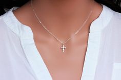 "Sterling Silver Cross Necklace - Religious Jewelry - Tiny Sterling silver CZ Cross Necklace - Layering Necklace Dainty Cross Necklace - Gift for Her ★★The necklace makes of .... -Sterling Silver 9.4x17.5mm Small CZ Cross Pendant, 3.2mm Closed Ring Sterling silver cable chain with spring claw . -Total length will be 16\" 17\" 18\" or 19\" depend on customer request. -Come up with beautiful ribbon gift box -One set of care instruction package that enhance your present ... All quantities are avail Silver Sterling Silver Cross Necklace, Spiritual Cross Necklace With Silver Chain For Gift, Elegant Silver Cross Charm Necklaces, Elegant Sterling Silver Cross Necklace As Gift, Elegant Silver Cross Necklace For Wedding, Silver Cross Necklaces For Wedding, Elegant Silver Chain Cross Necklace Gift, White Gold Sterling Silver Cross Necklace For Wedding, Gift Silver Chain Jewelry With Cross Pendant