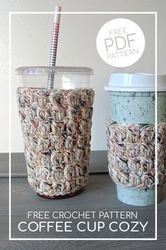 two crocheted coffee cups sitting next to each other